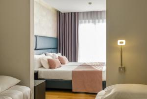 Postel nebo postele na pokoji v ubytování Hotel Rosa Mística by Umbral