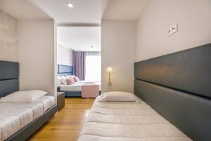 Postel nebo postele na pokoji v ubytování Hotel Rosa Mística by Umbral