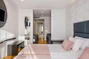 Postel nebo postele na pokoji v ubytování Hotel Rosa Mística by Umbral