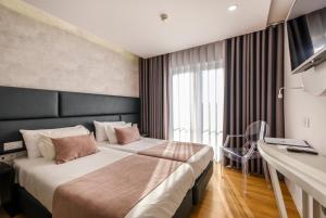 Postel nebo postele na pokoji v ubytování Hotel Rosa Mística by Umbral