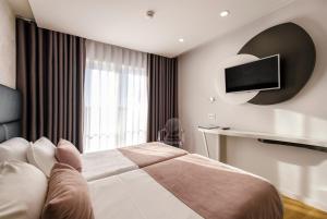 Postel nebo postele na pokoji v ubytování Hotel Rosa Mística by Umbral