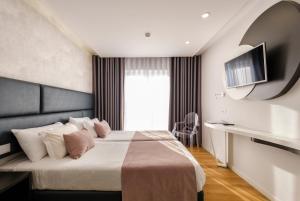 Postel nebo postele na pokoji v ubytování Hotel Rosa Mística by Umbral