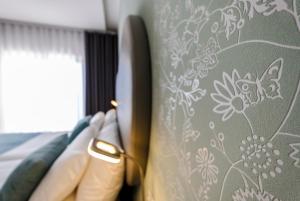Postel nebo postele na pokoji v ubytování Hotel Rosa Mística by Umbral