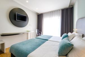 Postel nebo postele na pokoji v ubytování Hotel Rosa Mística by Umbral