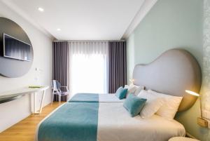 Postel nebo postele na pokoji v ubytování Hotel Rosa Mística by Umbral