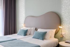 Postel nebo postele na pokoji v ubytování Hotel Rosa Mística by Umbral
