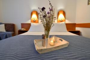 Ένα ή περισσότερα κρεβάτια σε δωμάτιο στο Hotel Alkar