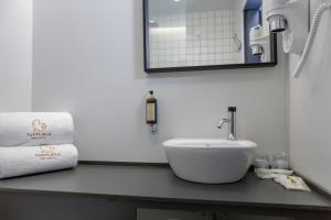 Uma casa de banho em Sport Hotel Gym + SPA