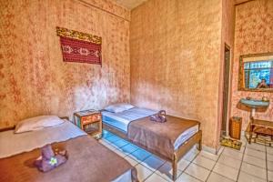 Postel nebo postele na pokoji v ubytování Lovina Central Hostel