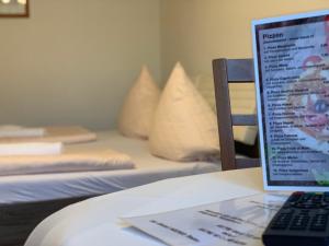 Postel nebo postele na pokoji v ubytování Hotel Restaurant Memo