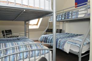 two bunk beds in a dorm room with at The Hostel in Edinburgh