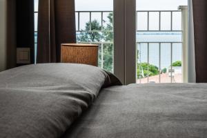 Posteľ alebo postele v izbe v ubytovaní Hotel Palazzo del Garda & Spa