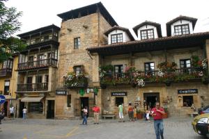 a group of people standing in front of a building at Centrico Y Acogedor in Comillas