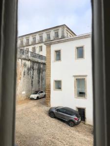 a car parked in front of a house at São Bento na Alta St Benedict Uptown in Coimbra