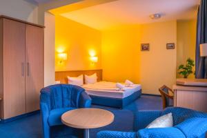 Postel nebo postele na pokoji v ubytování Hotel Wilder Mann