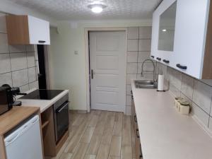 A kitchen or kitchenette at Csóka Apartman Pápa Még 11 kép