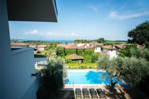 a view of a swimming pool from a house at Villa Solelago Exclusive in Lonato