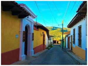 an alley in a town with colorful buildings at Casa Tequio in San Cristóbal de Las Casas