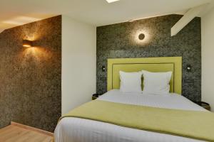Villa Erizio, a bucolic and urban break客房内的一张或多张床位