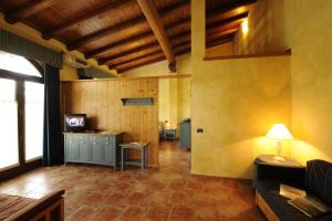 a living room with a couch and a table at Agriturismo Gian Galeazzo Visconti in Valeggio sul Mincio