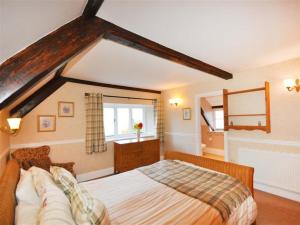 Voodi või voodid majutusasutuse Ivy Cottage toas