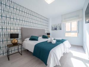 Postel nebo postele na pokoji v ubytování MALAGUETA SEA VIEW - PREMIUM APARTMENT