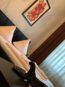 En eller flere senge i et værelse på Hotel Restaurant Memo