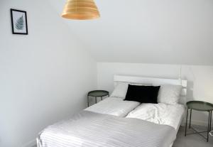 Posteľ alebo postele v izbe v ubytovaní Zielone Apartamenty