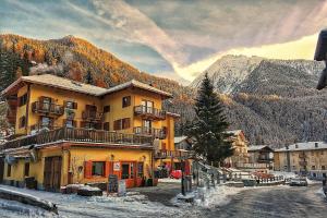 a large building in the middle of a mountain at Le Nid de l'Aigle in Champoluc