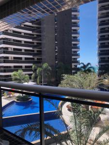 a view from the balcony of a building with a swimming pool at Landscape Residence by Escala Imóveis in Fortaleza