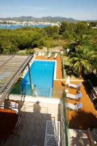 a view of a swimming pool from a building at S'Arenal Petit in Portocolom +15 photos