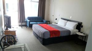 Postel nebo postele na pokoji v ubytování Bay Palm Motel