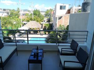a balcony with a view of a swimming pool at Depto. Hanna #5 in Bucerías