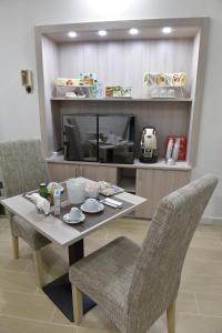 Príslušenstvo na prípravu kávy alebo čaju v ubytovaní Bed And Breakfast Garibaldi54