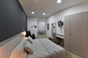 Televízia a/alebo spoločenská miestnosť v ubytovaní Bed And Breakfast Garibaldi54