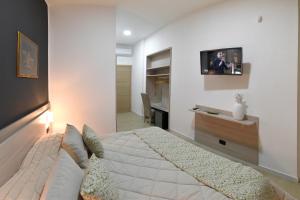 Televízia a/alebo spoločenská miestnosť v ubytovaní Bed And Breakfast Garibaldi54