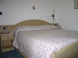 Postel nebo postele na pokoji v ubytování Hotel Negritella