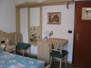 Postel nebo postele na pokoji v ubytování Hotel Negritella