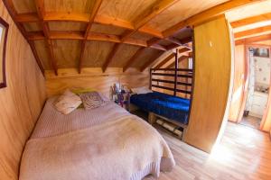 Cama o camas de una habitación en Cabañas Ruka Wasi