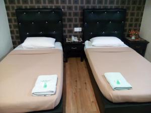 Postel nebo postele na pokoji v ubytování BINKHALED HOTEL