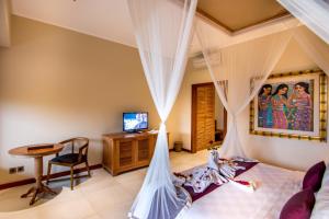 TV o dispositivi per l'intrattenimento presso Ulun Ubud Resort - CHSE Certified