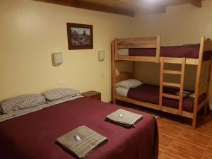 Cama ou camas em um quarto em Hostal Ckamai