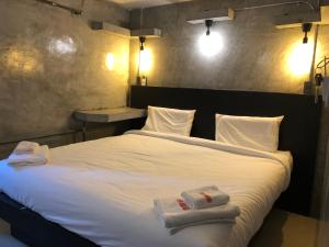 Postel nebo postele na pokoji v ubytování AVA Boutique Guesthouse