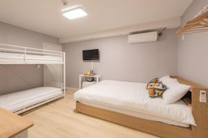 Postel nebo postele na pokoji v ubytování Daol Guesthouse