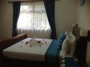 Voodi või voodid majutusasutuse Seashell Beach Villa toas