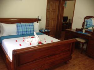 Voodi või voodid majutusasutuse Seashell Beach Villa toas