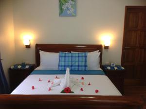 Voodi või voodid majutusasutuse Seashell Beach Villa toas