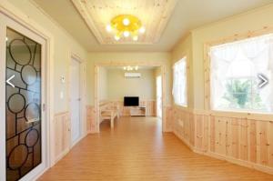 a large room with a hard wood floor and a ceiling at Sweetsalt in Seogwipo