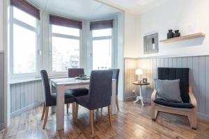 a dining room with a table and two chairs at Charmant appartement met zicht Damse vaart @Brugge in Bruges