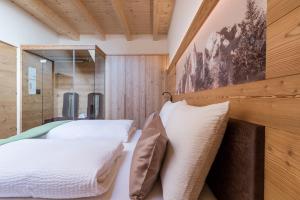 A bed or beds in a room at Les Pizades